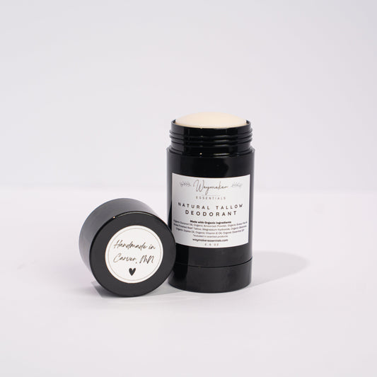 Black deodorant stick with white label on a light gray background - Natural ingredients Tallow Deodorant