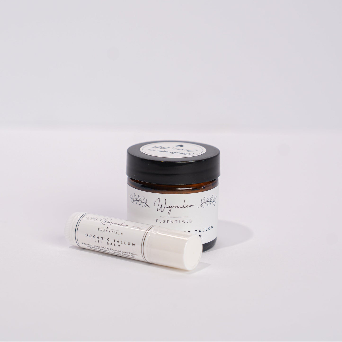 Small jar and roll-on bottle on a light gray background - Tallow Lip Balm, Organic Tallow