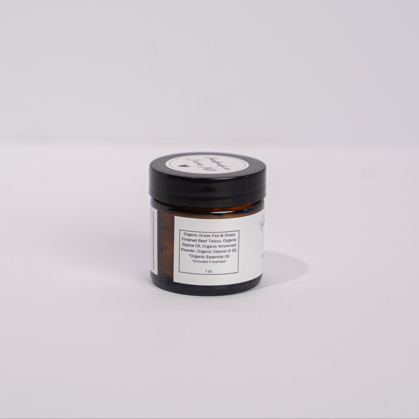 Small jar with a label on a white background - Organic whipped tallow body butter