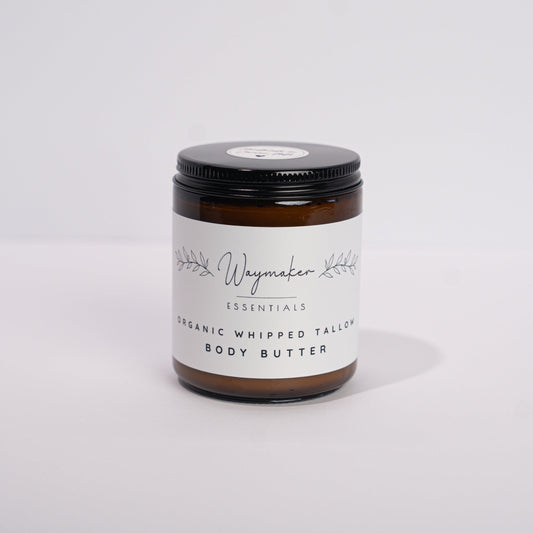 Jar of body butter on a white background