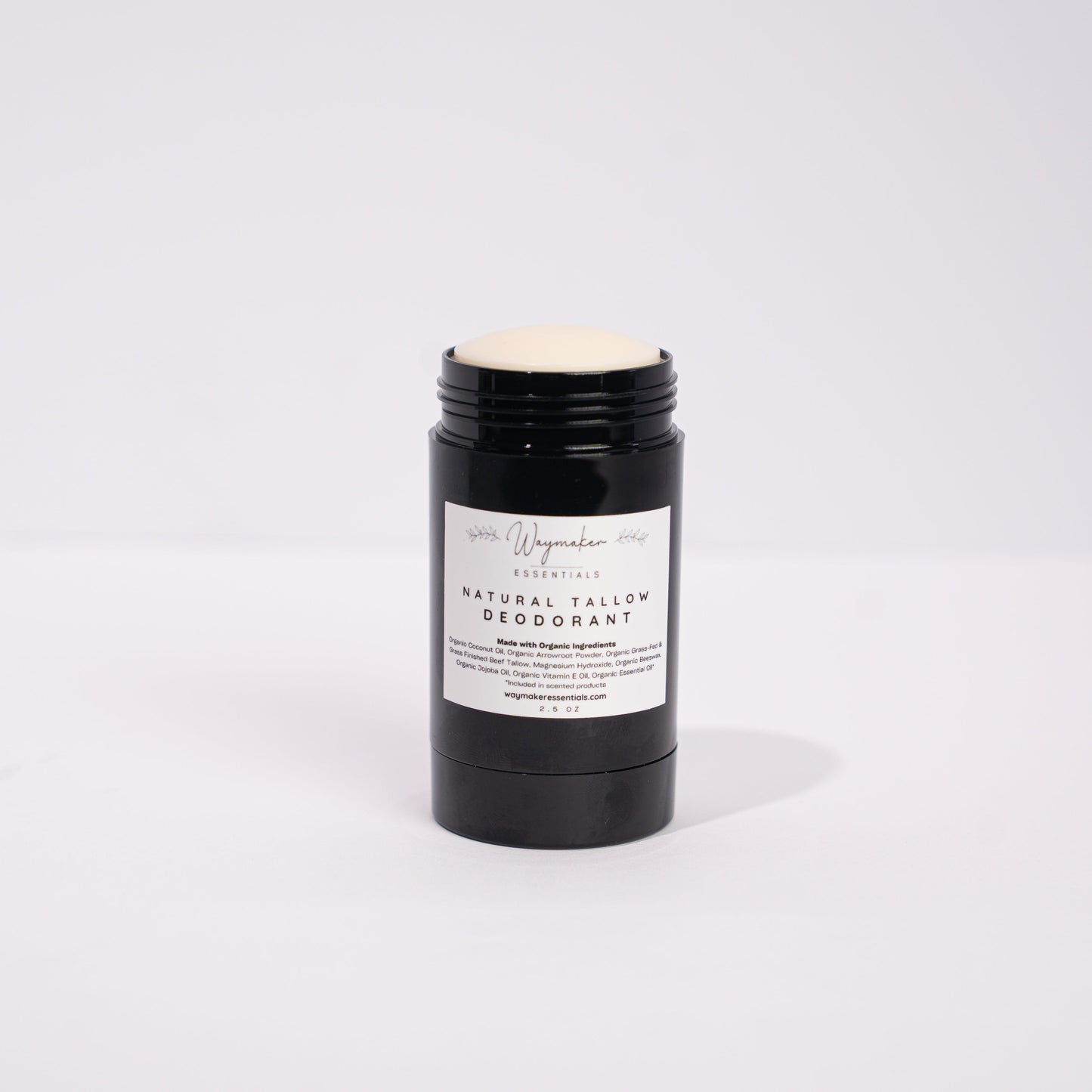 Black deodorant stick with a white label on a light gray background -Organic Tallow