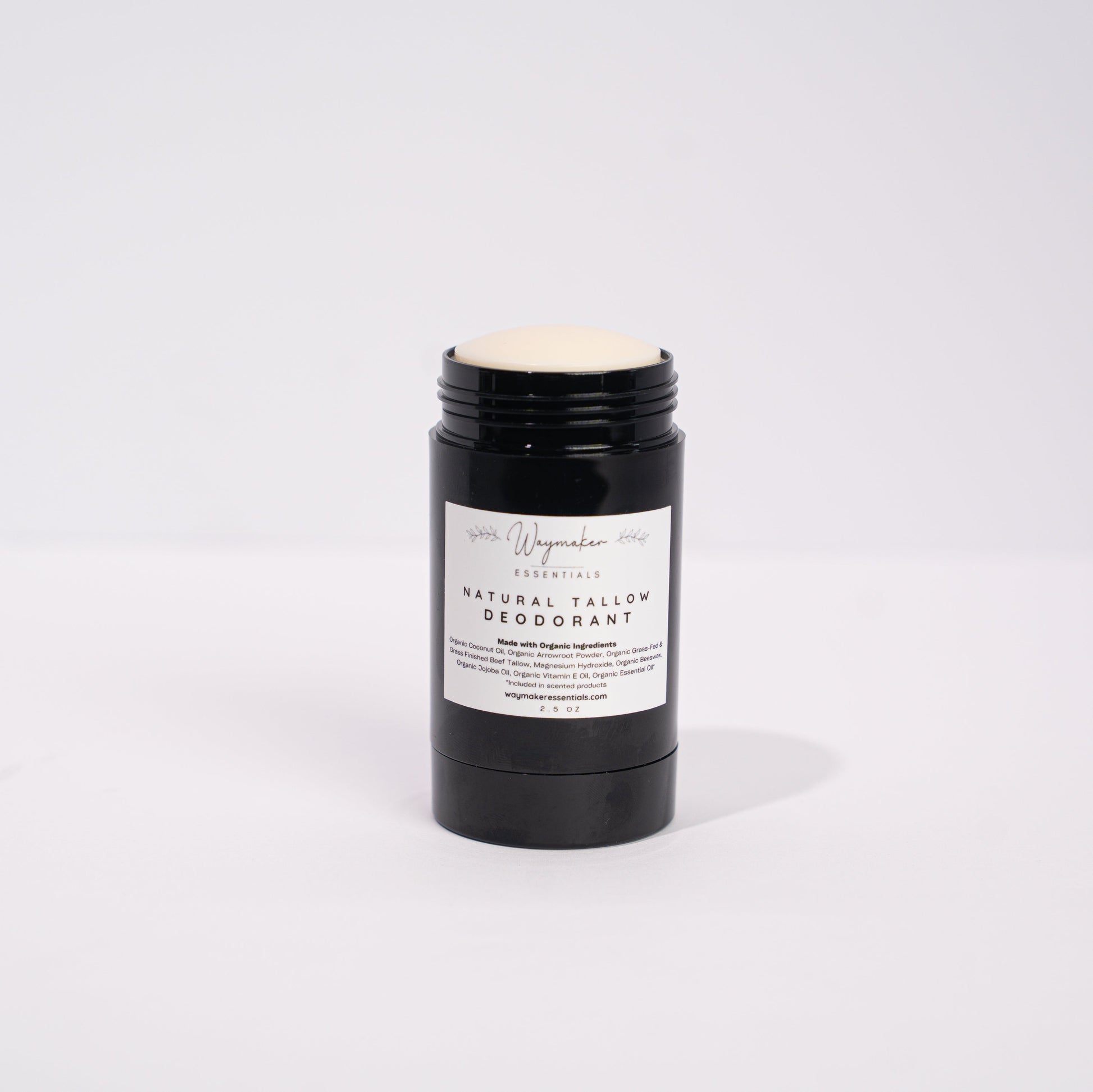 Black deodorant stick with a white label on a light gray background -Organic Tallow