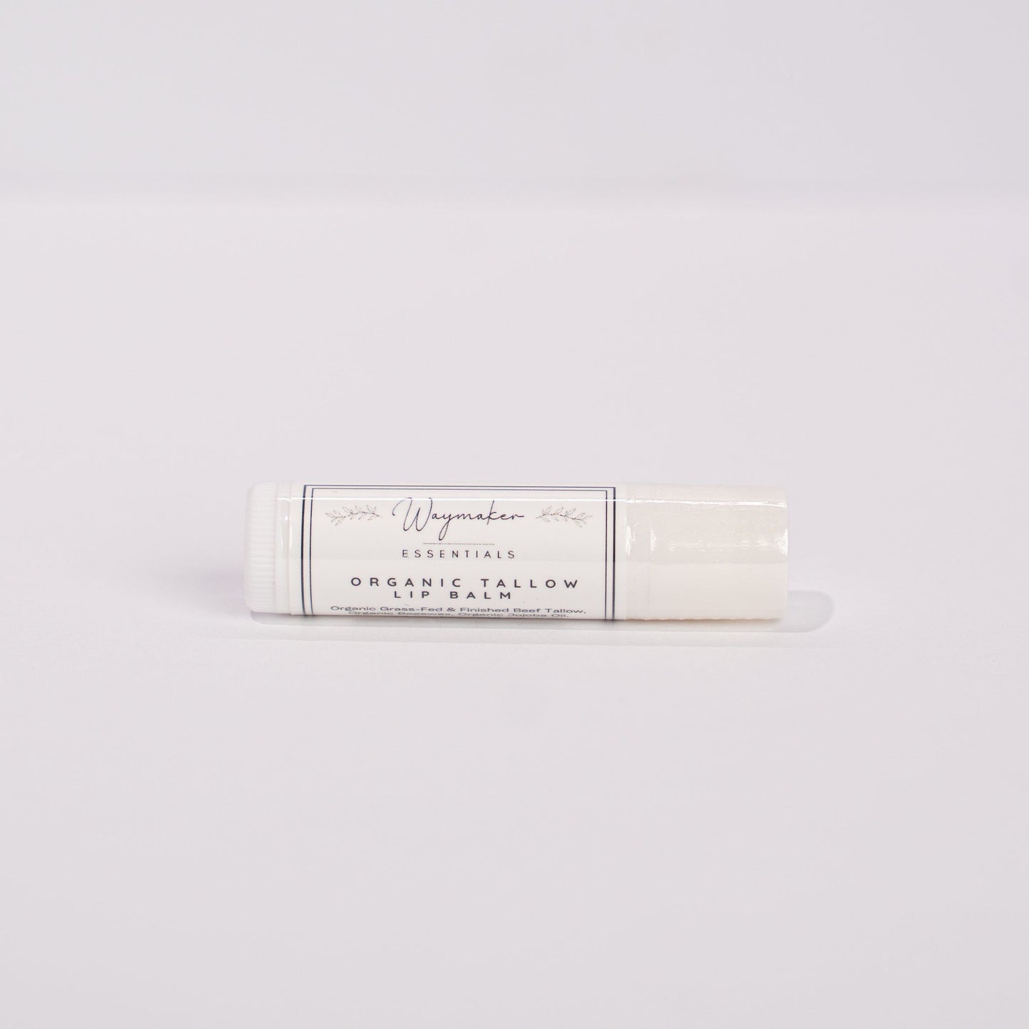 Lip balm on a light gray background