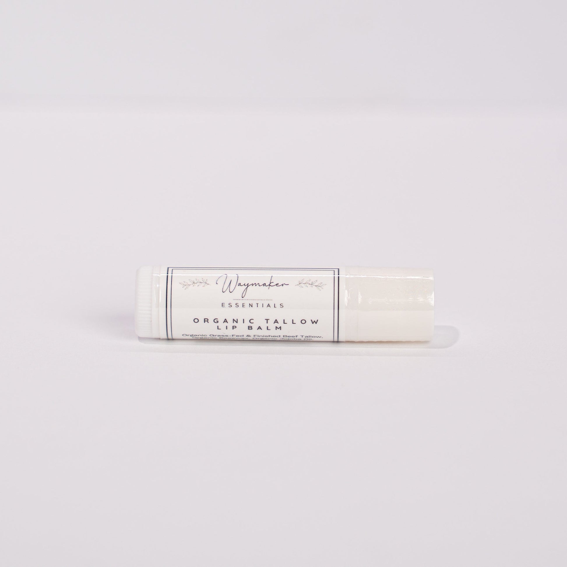 Lip balm on a light gray background